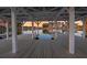 Lakeside pavilion with wooden floor, exposed roof beams, and sunset view at 207 Calm Water Way, Summerville, SC 29486