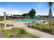 Relaxing community pool area featuring lounge chairs and native grasses at 207 Calm Water Way, Summerville, SC 29486
