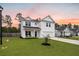 Charming two-story home featuring a landscaped front yard and inviting covered porch at 217 Lucca Dr, Summerville, SC 29486