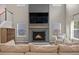 Fireplace with a gray mantle and burning fire at 217 Lucca Dr, Summerville, SC 29486