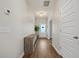 View of the hallway featuring wood floors, storage, white doors, and decor at 217 Lucca Dr, Summerville, SC 29486