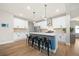 Contemporary kitchen showcasing stainless steel appliances, white cabinetry, and a spacious center island at 217 Lucca Dr, Summerville, SC 29486