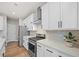 Modern kitchen featuring stainless steel appliances, quartz countertops, and white cabinetry at 217 Lucca Dr, Summerville, SC 29486