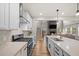 Spacious kitchen with a view to the living room with fireplace and staircase to the second floor at 217 Lucca Dr, Summerville, SC 29486