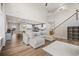 Comfortable living room with hardwood floors and an open layout to the kitchen and dining areas at 217 Lucca Dr, Summerville, SC 29486