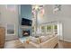 Living room with a modern fireplace, large windows, and hardwood floors at 217 Lucca Dr, Summerville, SC 29486