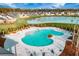 Resort-style community pool with a lake view and plenty of lounge space at 217 Lucca Dr, Summerville, SC 29486