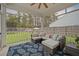 Relaxing screened porch featuring comfortable seating and a view of the landscaped backyard at 217 Lucca Dr, Summerville, SC 29486