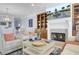 Comfortable living room featuring a fireplace, built-in shelving, and an open layout design at 217 Slipper Shell Ct, Mount Pleasant, SC 29464