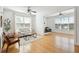 Spacious living room featuring hardwood floors, neutral furniture, and bright, natural light at 2244 Ashley Crossing Dr # 1232, Charleston, SC 29414