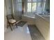 Bright bathroom with a soaking tub, walk-in shower, and ample vanity space at 24 Commons Ct, Isle of Palms, SC 29451