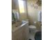 Bright bathroom with a white vanity, toilet, and coordinated decor offering a clean and classic look at 24 Commons Ct, Isle of Palms, SC 29451