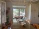Dining area with a table and chairs, featuring natural light and serene view of the outdoor area at 24 Commons Ct, Isle of Palms, SC 29451