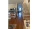 Hallway view showcasing the kitchen, stairs, and sightlines into other living spaces, highlighting open layout at 24 Commons Ct, Isle of Palms, SC 29451
