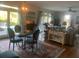 Open-concept living and dining area with a view of the pool, blending indoor and outdoor living at 24 Commons Ct, Isle of Palms, SC 29451
