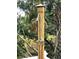 Private outdoor shower features modern fixtures with copper piping nestled amongst lush foliage at 24 Commons Ct, Isle of Palms, SC 29451