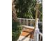 Outdoor shower area boasts wood flooring, privacy fence and lush tropical landscaping at 24 Commons Ct, Isle of Palms, SC 29451