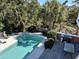 Inviting pool and patio area with lush landscaping, ideal for outdoor entertaining and relaxation at 24 Commons Ct, Isle of Palms, SC 29451