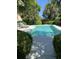 Serene outdoor pool area surrounded by lush greenery, featuring comfortable loungers and ample space for relaxation at 24 Commons Ct, Isle of Palms, SC 29451