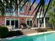 A beautiful outdoor pool area with a deck and seating, perfect for relaxation and entertaining guests at 24 Commons Ct, Isle of Palms, SC 29451