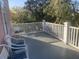 Inviting outdoor porch with white railings and comfortable seating for relaxing and enjoying the view at 24 Commons Ct, Isle of Palms, SC 29451