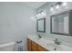 Well-lit bathroom boasts double sinks, framed mirrors, and neutral wall color at 249 Brookshire Rd, Goose Creek, SC 29445