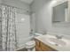 A clean bathroom featuring a shower-tub combo with patterned curtain, and a sink at 249 Brookshire Rd, Goose Creek, SC 29445