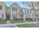 Inviting townhouse with symmetrical design, landscaped front, and covered entryway at 249 Brookshire Rd, Goose Creek, SC 29445