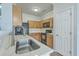 Well-lit kitchen featuring wooden cabinetry, modern appliances, and a stylish faucet at 249 Brookshire Rd, Goose Creek, SC 29445