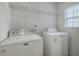 White laundry room featuring Maytag washer and dryer under wire shelving at 249 Brookshire Rd, Goose Creek, SC 29445