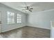 View of the living room featuring natural light, neutral paint colors, hardwood floor, and a ceiling fan at 249 Brookshire Rd, Goose Creek, SC 29445