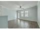 Spacious living room with natural light, hard wood floors, ceiling fan, and a patio door at 249 Brookshire Rd, Goose Creek, SC 29445