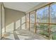 Enclosed screened porch with views of backyard foliage and natural light at 249 Brookshire Rd, Goose Creek, SC 29445
