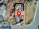 Birds-eye view of home showing fenced in backyard, mature trees and surrounding neighborhood at 2825 Backman St, Mount Pleasant, SC 29466