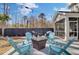 Charming backyard patio with comfortable seating around a fire pit, perfect for outdoor gatherings at 2825 Backman St, Mount Pleasant, SC 29466