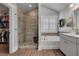 The bathroom features a separate shower and tub, plus access to a walk-in closet at 2825 Backman St, Mount Pleasant, SC 29466