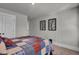 A standard bedroom features neutral paint, carpet, and modern art pieces on the wall at 2825 Backman St, Mount Pleasant, SC 29466