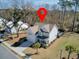 Aerial view of a two-story home featuring a covered front porch, attached garage, and mature landscaping at 2825 Backman St, Mount Pleasant, SC 29466