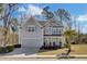 Charming two-story home with gray siding, well-maintained landscaping, and an attached two-car garage at 2825 Backman St, Mount Pleasant, SC 29466