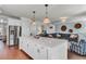 Spacious kitchen with island seating, stainless steel appliances, and connection to the living room at 2825 Backman St, Mount Pleasant, SC 29466