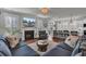 Inviting living room with a fireplace, modern decor, and hardwood floors that seamlessly blend comfort with contemporary elegance at 2825 Backman St, Mount Pleasant, SC 29466