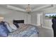 A bright primary bedroom boasts a chandelier and access to an ensuite bathroom at 2825 Backman St, Mount Pleasant, SC 29466