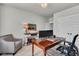 Bright home office with a modern desk setup, a cozy seating area, and neutral decor, creating an ideal workspace at 2825 Backman St, Mount Pleasant, SC 29466