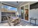 Inviting screened porch with dining set and seamless access to the kitchen, perfect for entertaining at 2825 Backman St, Mount Pleasant, SC 29466