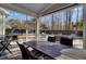 Relaxing screened porch with dining and seating areas, perfect for enjoying the outdoor view at 2825 Backman St, Mount Pleasant, SC 29466