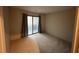 Bedroom with carpet and sliding glass door to a private balcony with natural light at 291 Sea Cloud Cir # 291, Edisto Island, SC 29438