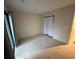 Spacious carpeted bedroom features a sliding glass door and large closet with curtain at 291 Sea Cloud Cir # 291, Edisto Island, SC 29438