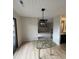 Dining area with wood floors, a modern light fixture, and access to a private balcony at 291 Sea Cloud Cir # 291, Edisto Island, SC 29438