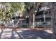 Condo building showcasing multiple units, each with a private balcony and mature trees adding shade and character at 291 Sea Cloud Cir # 291, Edisto Island, SC 29438