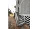 Exterior shot of the apartment featuring a set of weathered stairs leading to a ground-level entrance at 291 Sea Cloud Cir # 291, Edisto Island, SC 29438